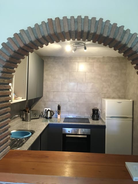 New kitchen, seen through the archway from the living room giving open plan feel