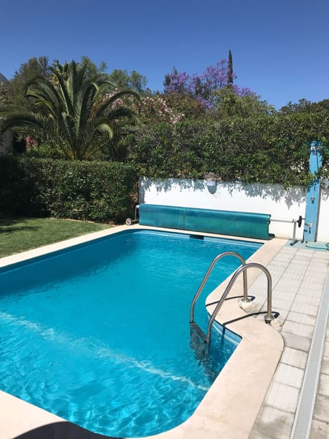 A heated pool, sun loungers