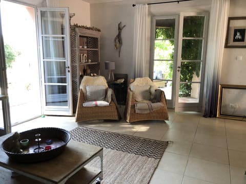 Another view of the sitting room. The doors on the left lead down to the pool