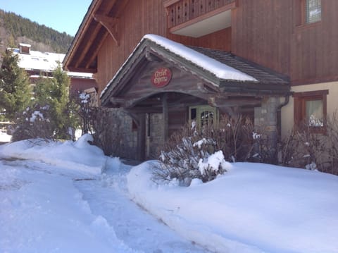 The front door of the apartment block. 