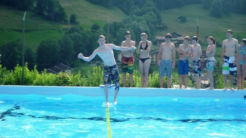 walking on rope in Lauterbrunnen swimmingpool