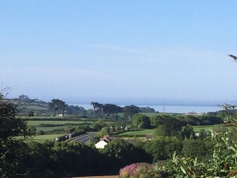 View on a sunny day from the master bedroom across to St Michaels Mount & the se