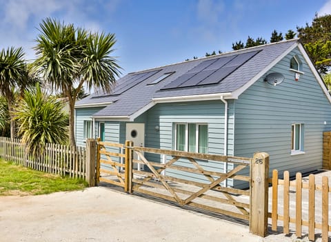 Front of Endless Summer with gated drive and parking for 2-3 cars