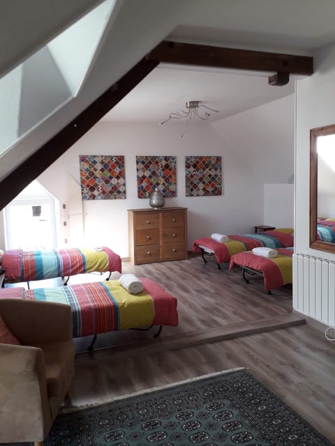 Second floor dormitory space with 4 single beds