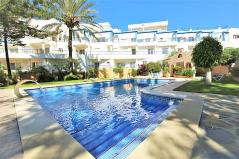 Inviting swimming pool available in the community surrounded by gardens
