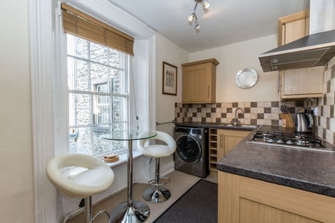 Kitchen with bar table & stools