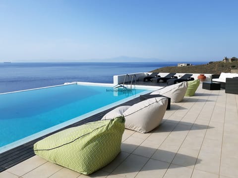 An infinity pool, sun loungers