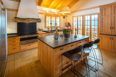 The kitchen has state of the art equipment with a large island