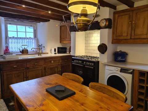 Range style dual fuel cooker, microwave, and washer/dryer