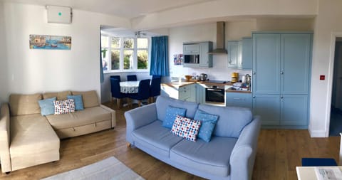 Open plan lounge kitchen & dining area,  double aspect views  & garden