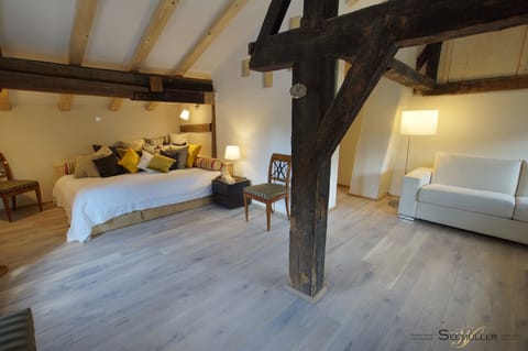 Living/Bedroom on the first floor with historic beams