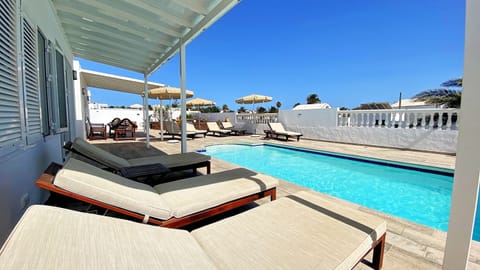 Outdoor pool, a heated pool, sun loungers