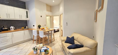 Open plan kitchen with living / dining area