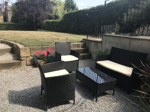 outdoor seating within large, private garden