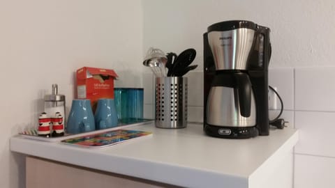 Fridge, stovetop, coffee/tea maker, electric kettle