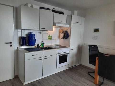 Fridge, oven, toaster, dining tables