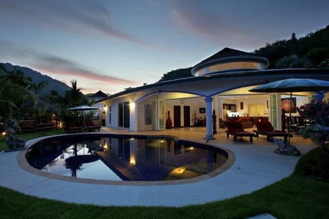 Front view of your villa with private pool at sunset