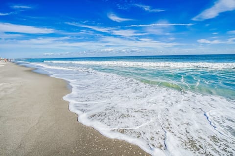 On the beach, sun loungers, beach towels