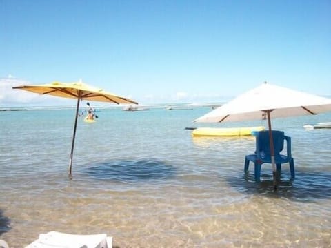 On the beach, sun loungers, beach towels