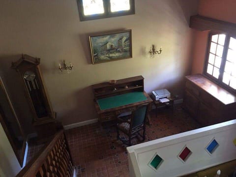 Mezzanine with desk and printer viewed from upstairs.