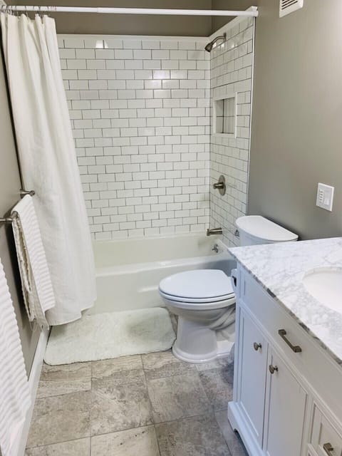 Combined shower/tub, hair dryer, towels, soap