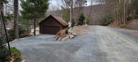 street view of driveway and parking area
