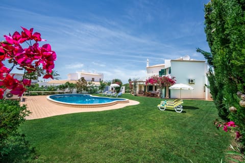 A heated pool, sun loungers