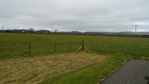 Rear of cottage.  There is a farm just out of sight on the left.