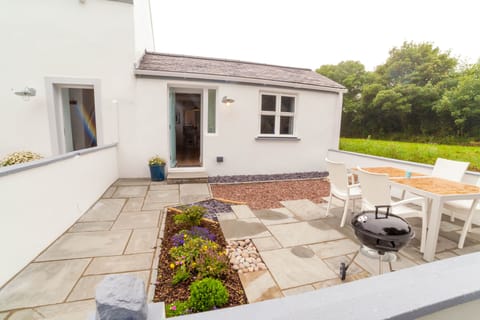 Outdoor space with secure gate, patio furniture and BBQ. All carefully designed.