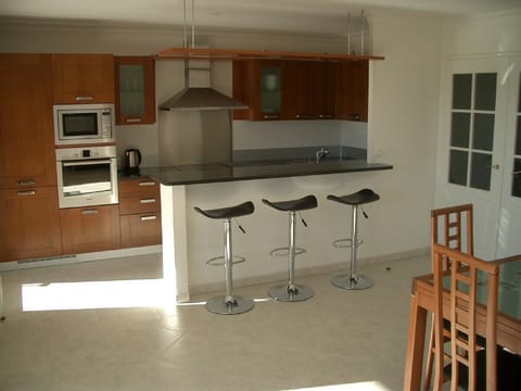 Open plan living space with granite breakfast bar