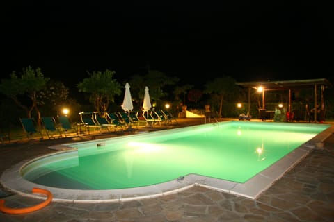 A heated pool, sun loungers