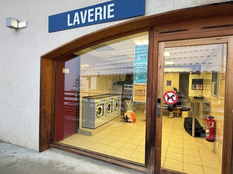 Local launderette which accepts card and has a detergent dispenser.