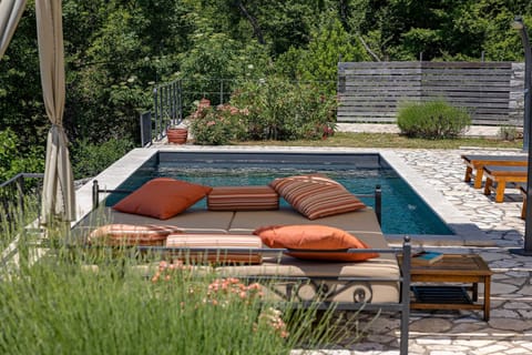 A heated pool, sun loungers