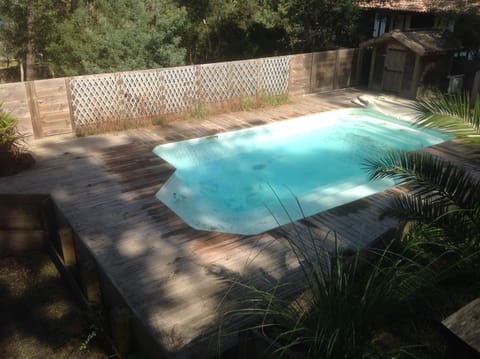 A heated pool, sun loungers