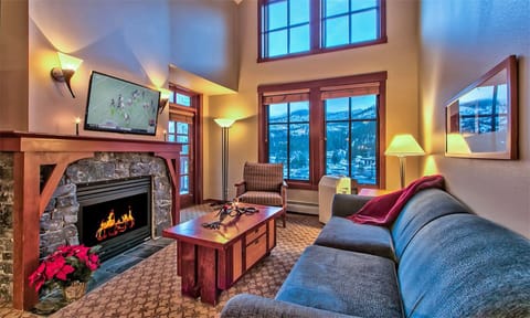 Living Room with gas fireplace, vaulted ceilings and LED HDTV.