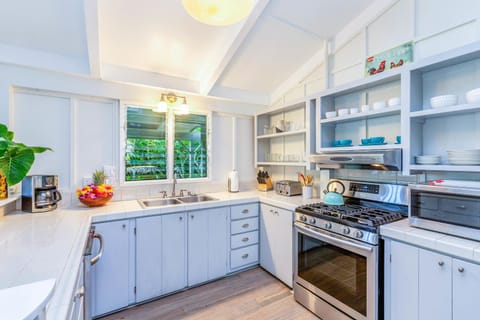 Whip up tropical meals in this open kitchen with updated appliances.