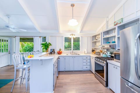Cook in comfort with modern amenities and a fresh, airy design made for island living.