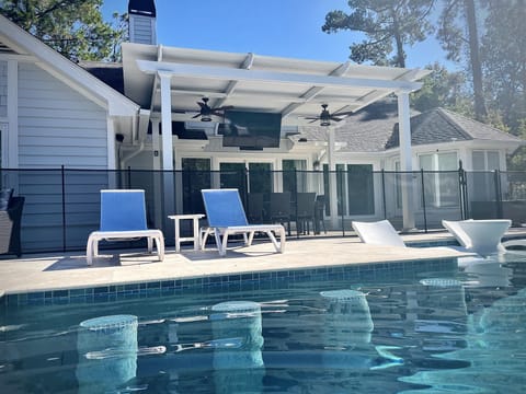 Outdoor pool, a heated pool, sun loungers