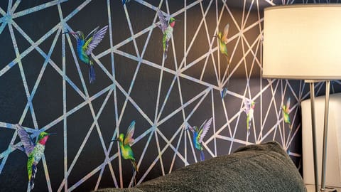 Bed #1- Holographic hummingbird wallpaper.