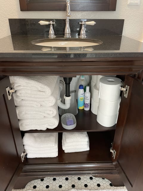 Combined shower/tub, hair dryer, towels, toilet paper