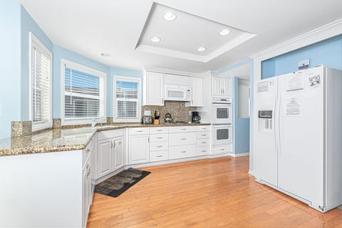 Kitchen comes stocked with dishes, utensils, cookware, bakeware, and all major and small appliances.