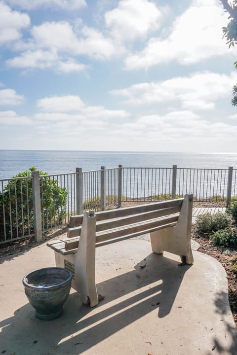 Park bench overlooking water just steps from the condo