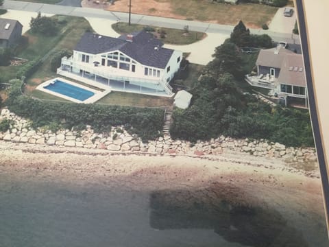 Aerial view of our home, swimming pool, upper & lower decks, steps downto Harbor