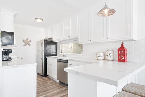 The kitchen comes stocked with dishes, utensils, cookware, bakeware, and all major and small appliances.