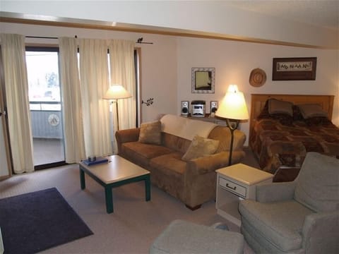 Living room with sliding glass doors leading to balcony