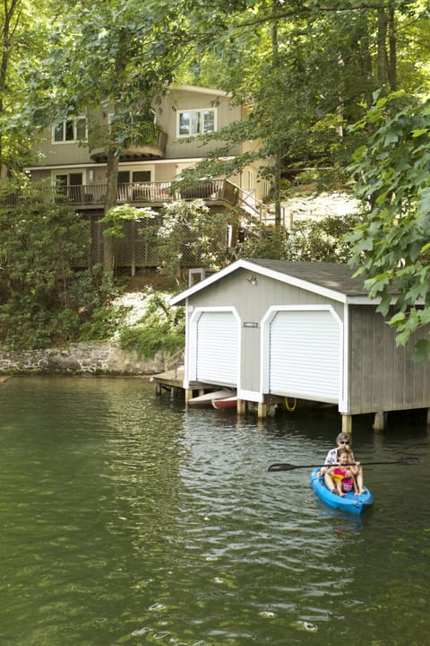 View of the house and boathouse from the lake.