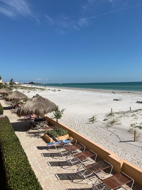 On the beach, sun loungers, beach towels