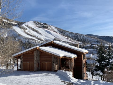 In the winter, enjoy this snow-covered beauty as your mountain home