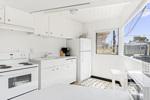 The kitchen comes stocked w/ cookware, dinnerware, utensils, and appliances for meal preparation (but no dishwasher)