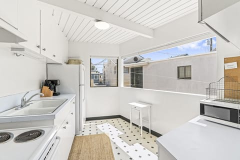 The kitchen comes stocked w/ cookware, dinnerware, utensils, and appliances for meal preparation (but no dishwasher)